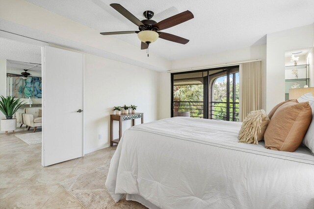 bedroom featuring a textured ceiling, access to outside, ceiling fan, and light tile patterned floors