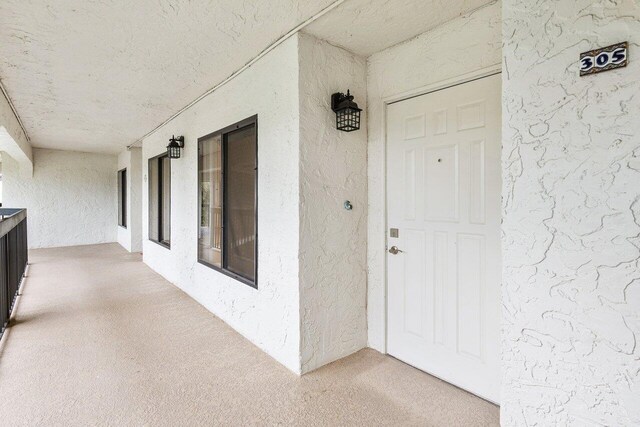 property entrance featuring covered porch