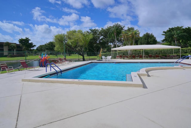 view of swimming pool featuring a patio