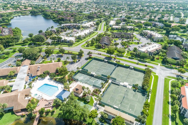 birds eye view of property with a water view