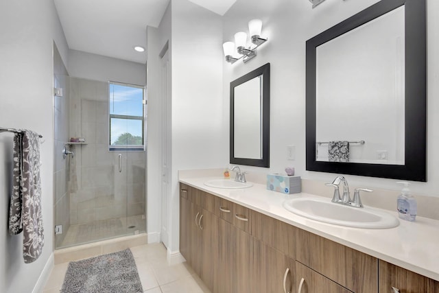 bathroom with vanity, an enclosed shower, and tile patterned flooring