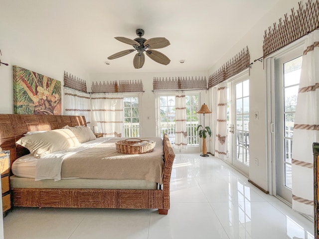 bedroom with access to exterior, multiple windows, ceiling fan, and light tile patterned floors