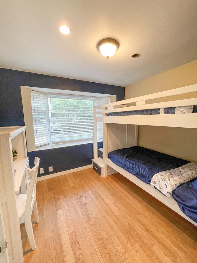 bedroom with light hardwood / wood-style floors