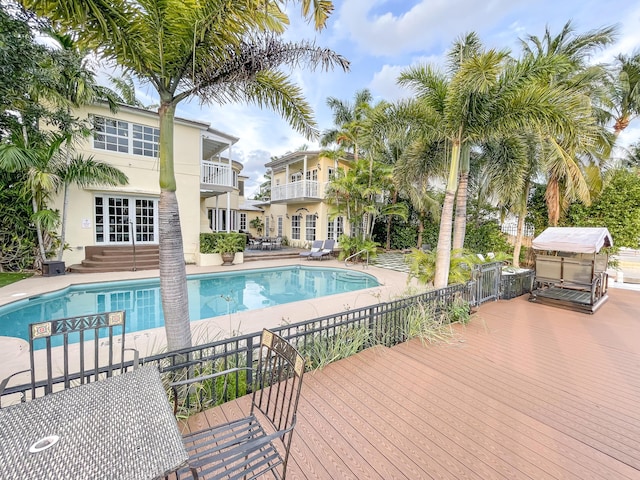 view of pool with a patio and french doors