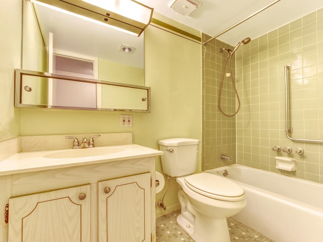 full bathroom with vanity, toilet, and tiled shower / bath combo