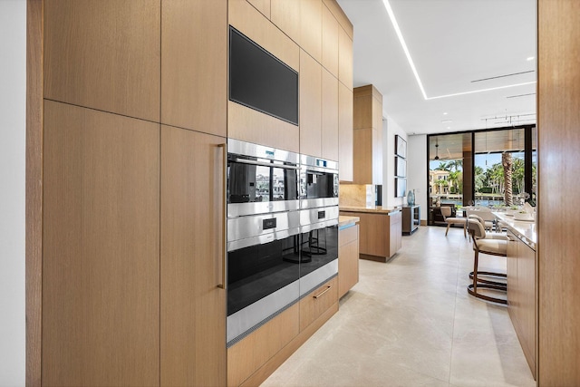 1520 Royal Palm Way, Boca Raton, FL 33432 - kitchen featuring modern cabinets and tasteful backsplash