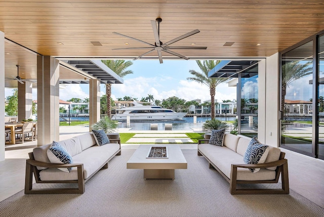 1520 Royal Palm Way, Boca Raton, FL 33432 - view of patio featuring an outdoor living space with a fire pit, ceiling fan, and a water view