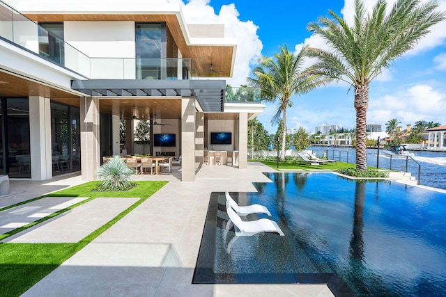 view of swimming pool featuring ceiling fan, a patio, and a pergola