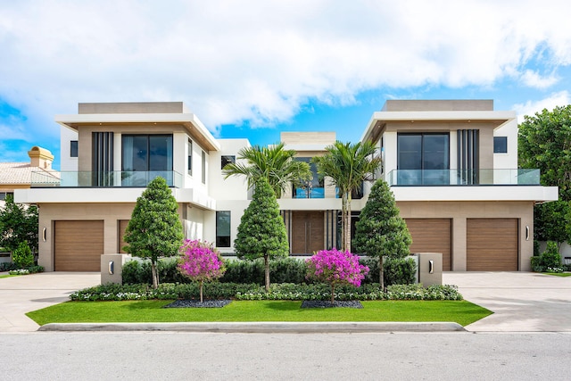 modern home featuring a balcony and a garage