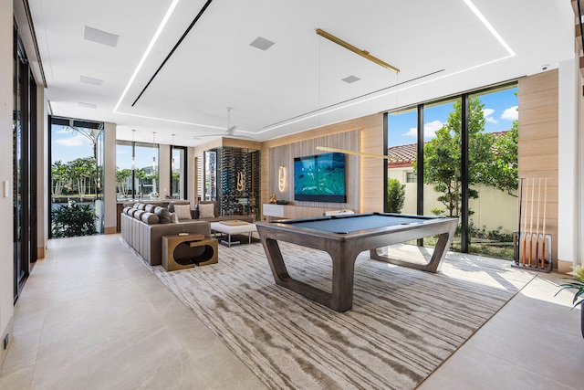 rec room with pool table and floor to ceiling windows