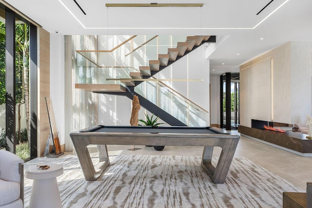 1520 Royal Palm Way, Boca Raton, FL 33432 - recreation room featuring billiards table, a fireplace, and concrete flooring