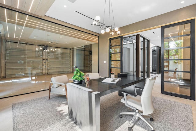 office space featuring an inviting chandelier