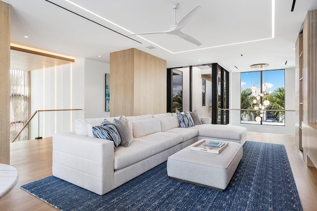 1520 Royal Palm Way, Boca Raton, FL 33432 - living room with wood finished floors, a ceiling fan, and a wall of windows