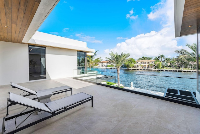 view of swimming pool featuring a water view