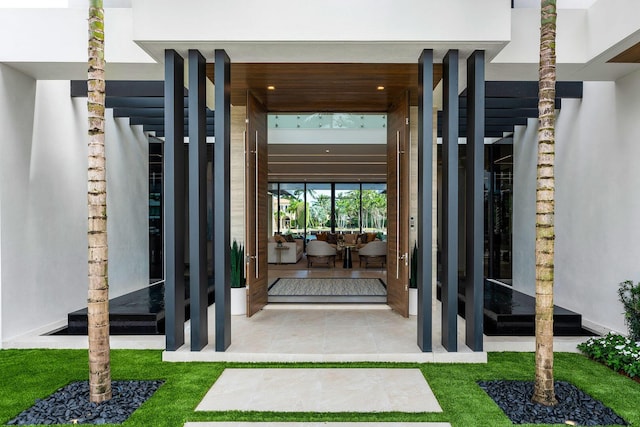 1520 Royal Palm Way, Boca Raton, FL 33432 - doorway to property with stucco siding