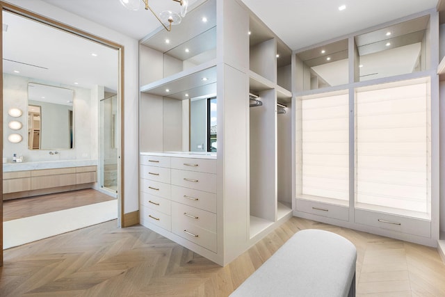 spacious closet with light parquet floors