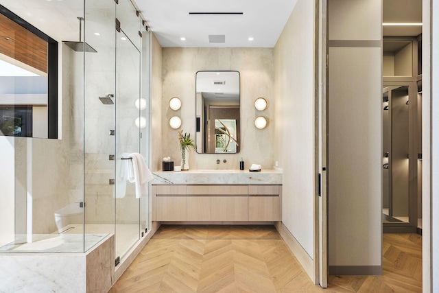 bathroom with vanity, parquet flooring, and a shower with door