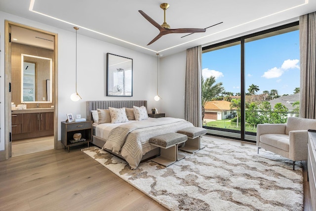 1520 Royal Palm Way, Boca Raton, FL 33432 - bedroom featuring light wood-style flooring, ensuite bath, access to outside, and a ceiling fan