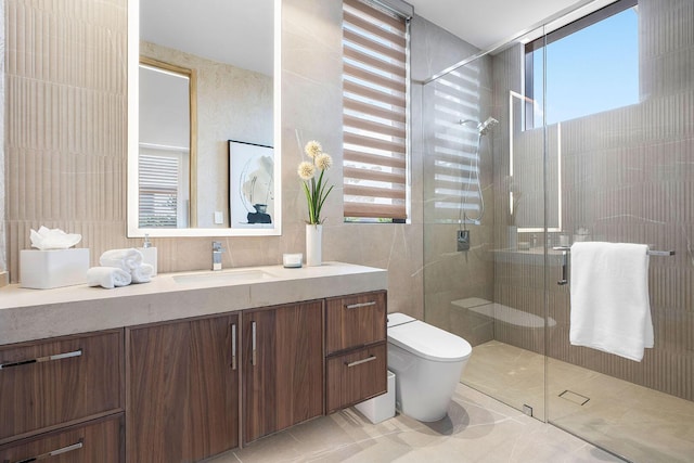 1520 Royal Palm Way, Boca Raton, FL 33432 - full bath featuring a stall shower, toilet, vanity, tile patterned flooring, and tile walls