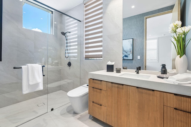 bathroom with vanity, toilet, and a shower with door