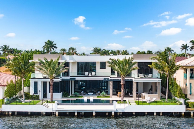 1520 Royal Palm Way, Boca Raton, FL 33432 - rear view of property featuring a balcony, a water view, and a patio area