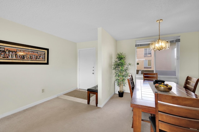 carpeted dining space with a textured ceiling and a notable chandelier