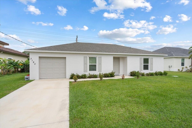 ranch-style house featuring a garage and a front yard