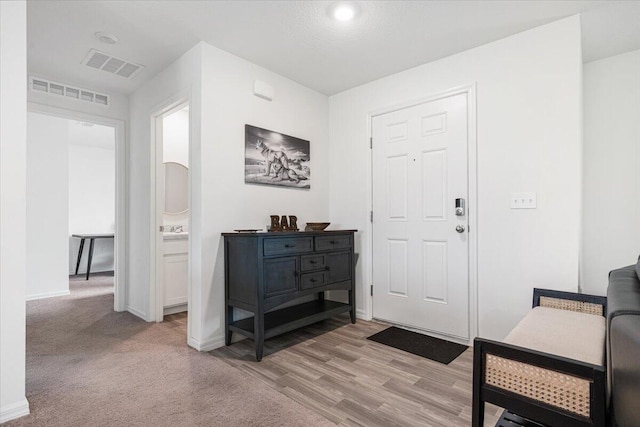 foyer featuring light hardwood / wood-style flooring