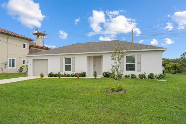 view of front facade with a front yard and a garage