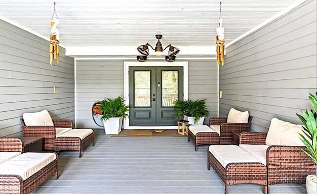 12151 Old Indiantown Rd, Jupiter, FL 33478 - doorway to property featuring french doors, a deck, and an outdoor hangout area