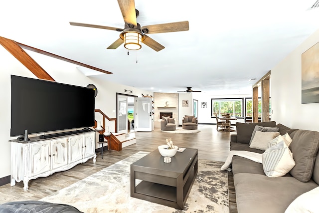 12151 Old Indiantown Rd, Jupiter, FL 33478 - living room featuring ceiling fan, light wood-style flooring, and baseboards