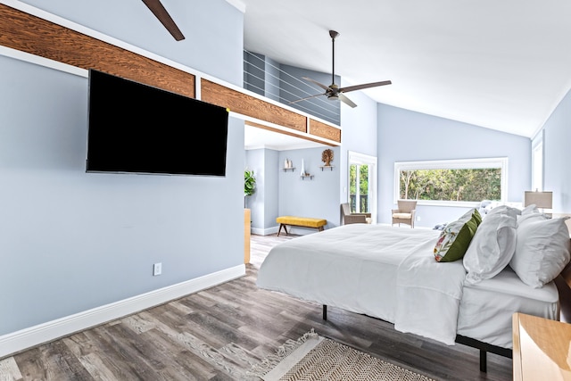 bedroom featuring hardwood / wood-style floors, ceiling fan, and high vaulted ceiling