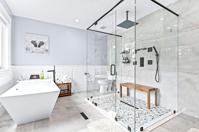 12151 Old Indiantown Rd, Jupiter, FL 33478 - full bathroom featuring a stall shower, a freestanding tub, a decorative wall, a wainscoted wall, and recessed lighting