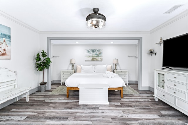 bedroom featuring dark hardwood / wood-style floors and crown molding