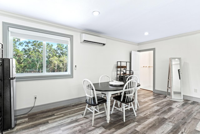 dining room featuring hardwood / wood-style floors, a wall mounted air conditioner, and crown molding