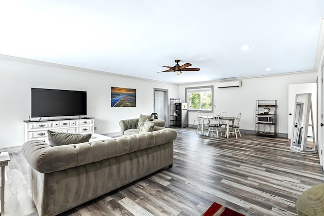 living room featuring ceiling fan, wood-type flooring, a wall mounted air conditioner, and ornamental molding