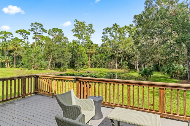 wooden terrace with a yard