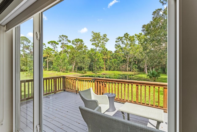 12151 Old Indiantown Rd, Jupiter, FL 33478 - wooden terrace with view of wooded area