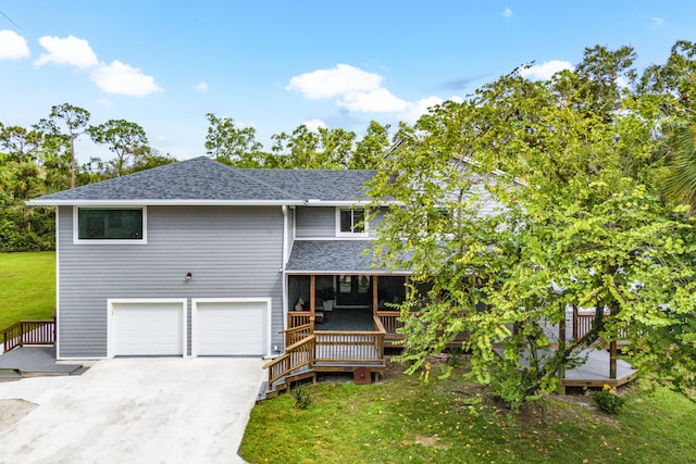 view of front of home featuring a garage and a front lawn