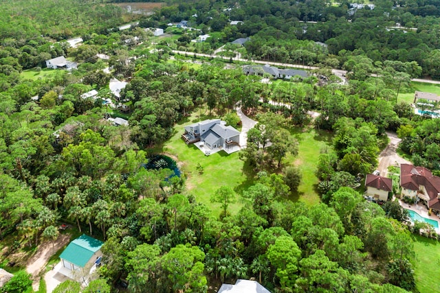 12151 Old Indiantown Rd, Jupiter, FL 33478 - aerial perspective of suburban area with a heavily wooded area