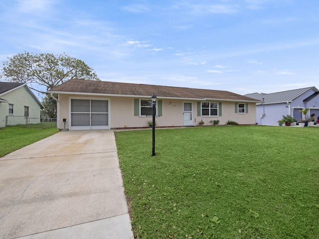 single story home with a front lawn and a garage