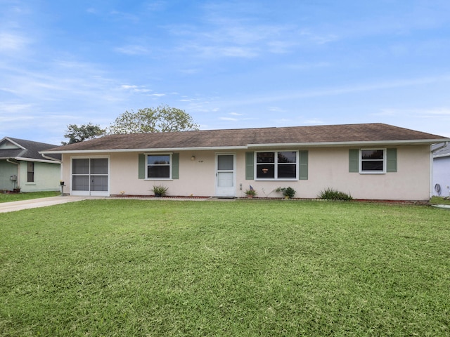 ranch-style house featuring a front lawn