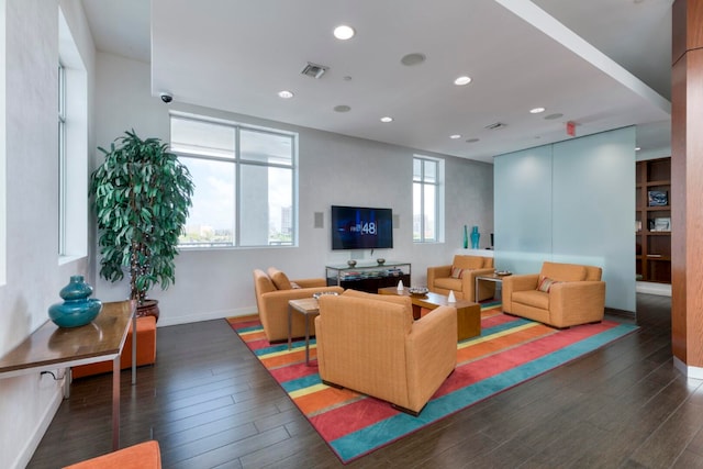 living room featuring dark hardwood / wood-style flooring