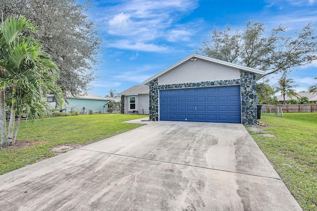 single story home with a garage and a front yard