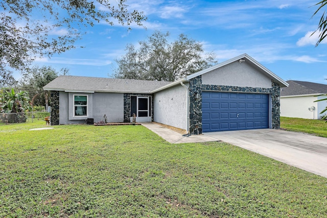 ranch-style house featuring a garage and a front lawn