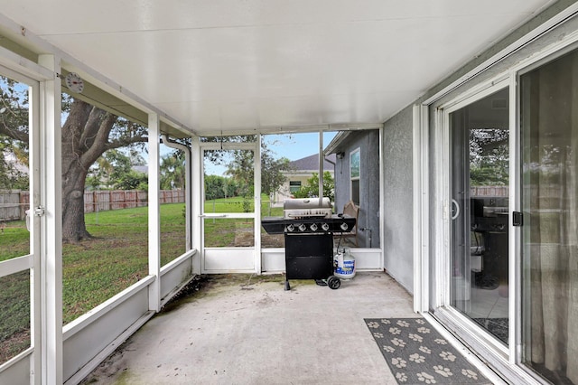 unfurnished sunroom featuring a healthy amount of sunlight