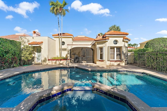 view of swimming pool featuring a sunroom