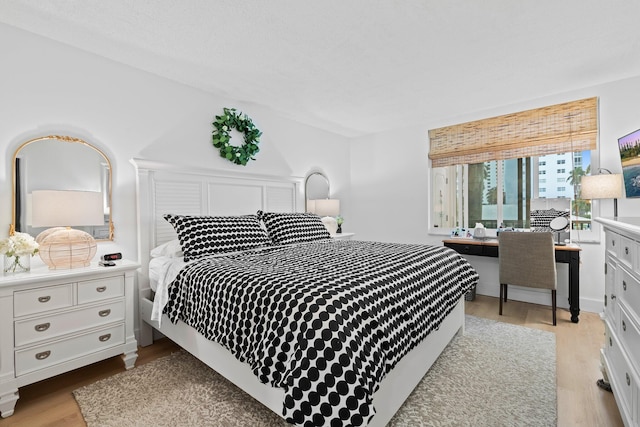 bedroom with light hardwood / wood-style floors