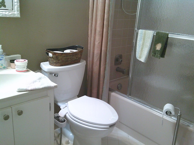 full bathroom with tile patterned floors, vanity, toilet, and shower / bathtub combination with curtain