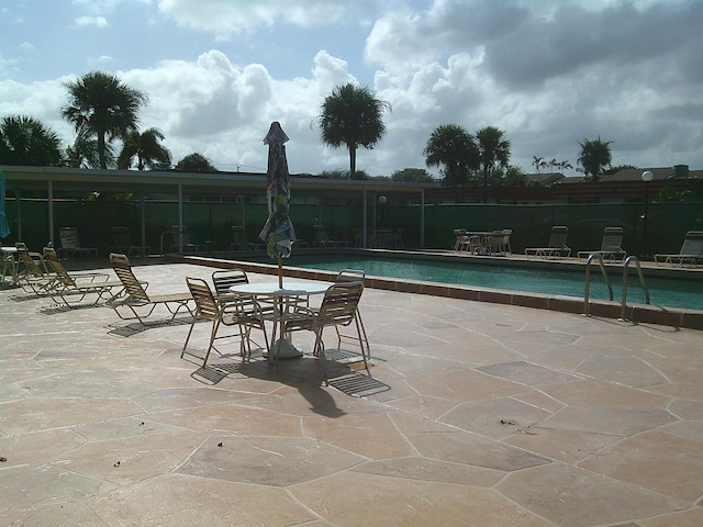 view of swimming pool featuring a patio area